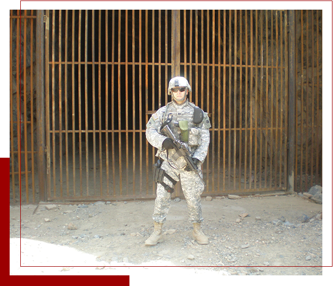 A soldier in camouflage holding an m 1 6 rifle.